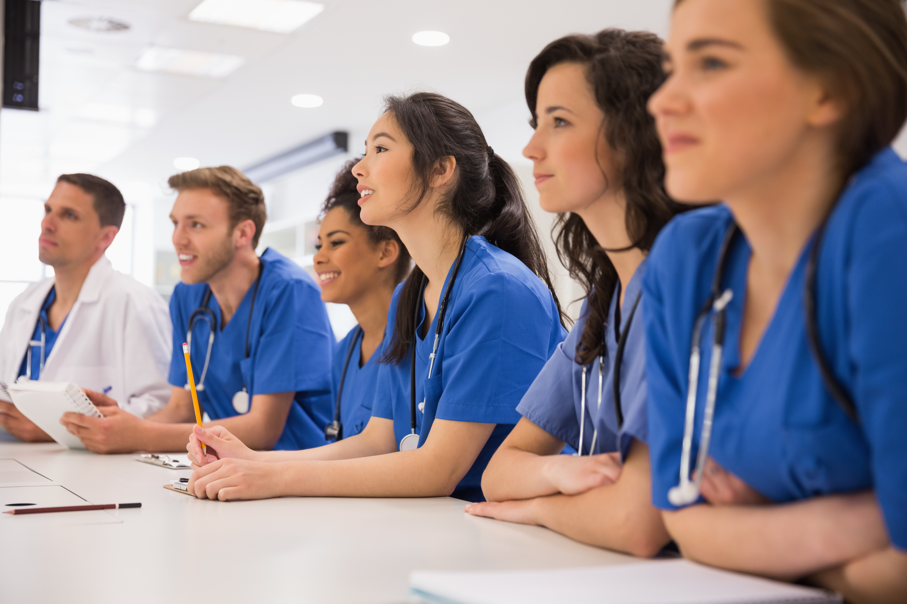 6 Medical professionals listening to a lecture